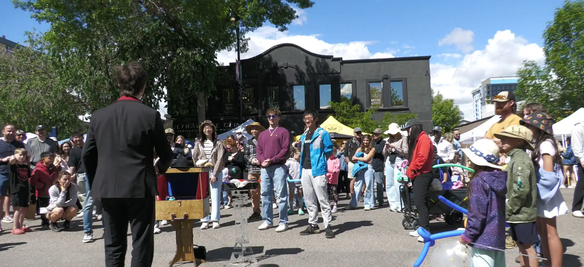 Crowd of people enjoying magic at the Lilac Festival